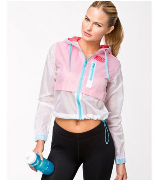 short running jacket in white and baby blue with black jogging tights