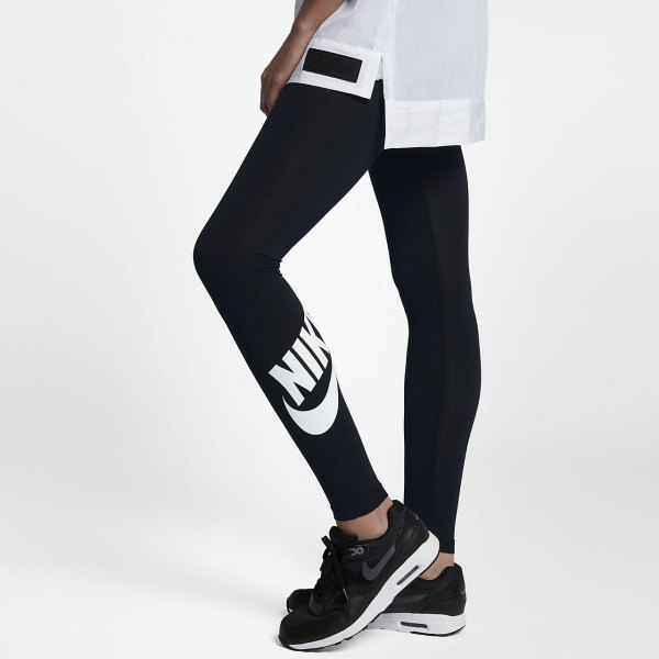 white oversized sports t-shirt with black high-waisted Nike leggings