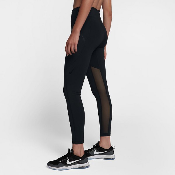 black crop top with matching, semi-transparent leggings with high waist and running shoes