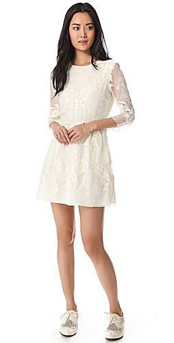 white mini dress with lace and flap lace and wingtip shoes