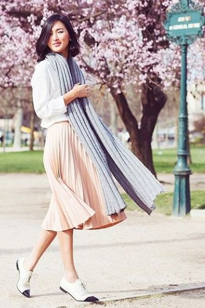 white sweatshirt with light pink pleated midi dress and oxfords