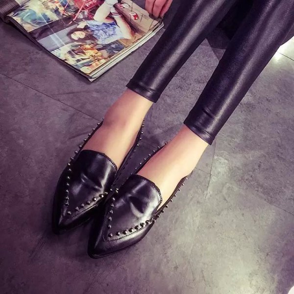 black leggings with matching wingtip shoes with rivets