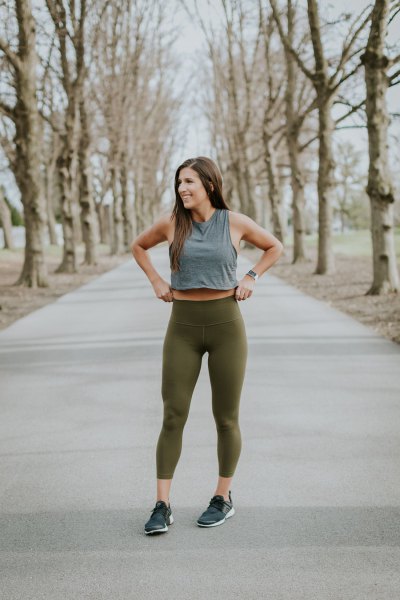 gray, short tank top with green, high-waisted leggings