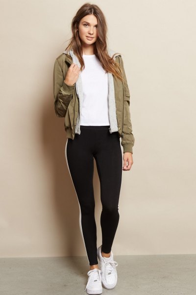brown fleece jacket with black leggings and white sneakers