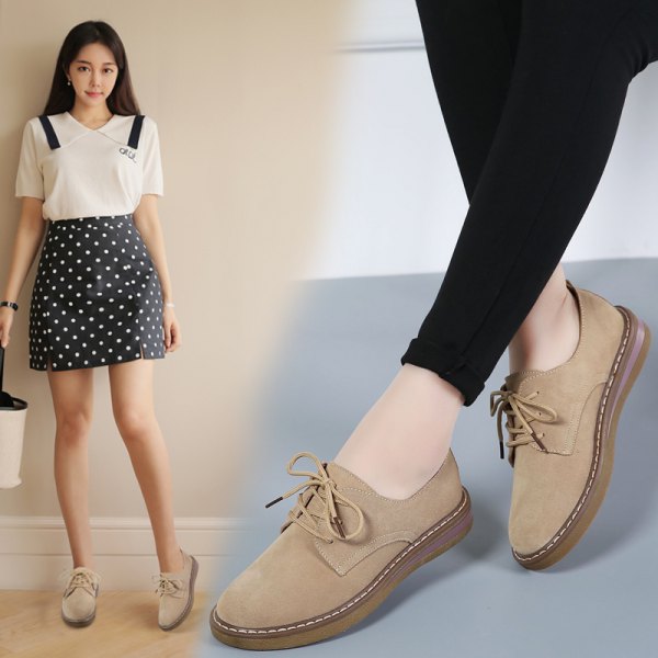 white blouse with black dotted mini skirt and light suede shoes made of camel