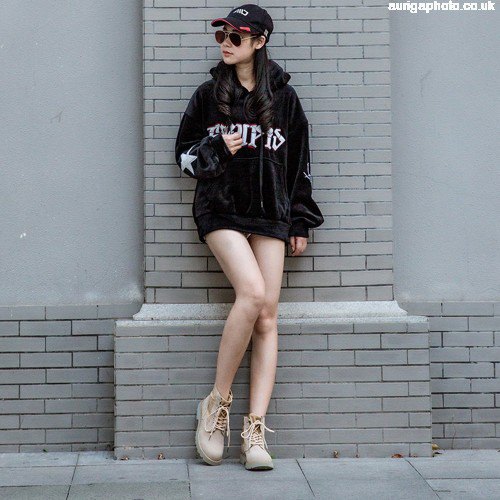 black hoodie dress with light brown shoes and baseball cap