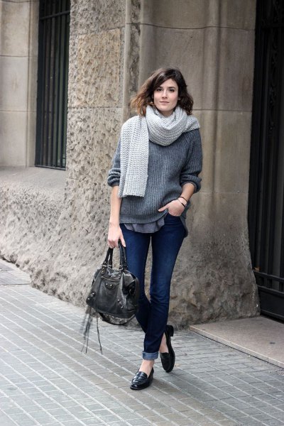 gray, chunky sweater with knitted scarf and jeans with cuffs