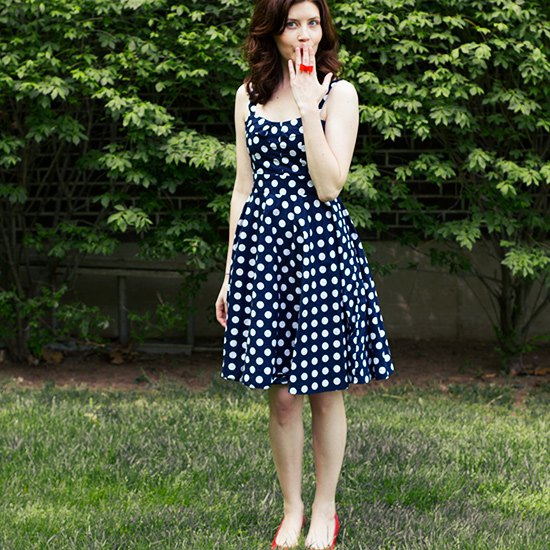 dark blue and white polka dot fit and flared midi dress