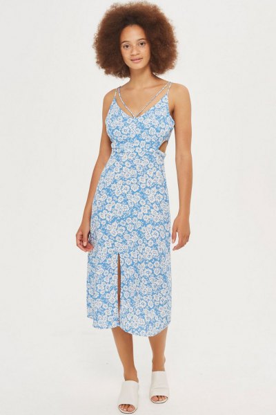 aqua and white midi dress with floral pattern and V-neck and white shoes with open toes