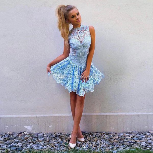 light blue sleeveless short skater dress made of lace with white heels