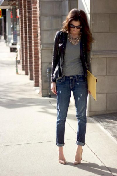 short leather jacket with gray t-shirt with a scoop neck and jeans with cuffs