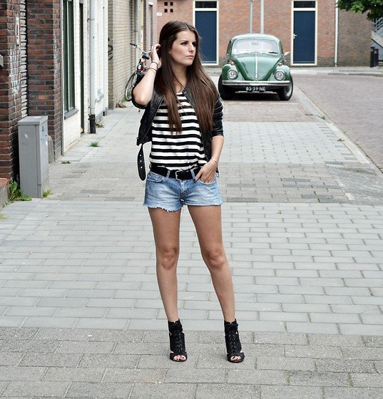 black and white striped t-shirt with short leather jacket and denim shorts