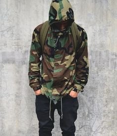 Hooded camo windbreaker with black baggy jeans