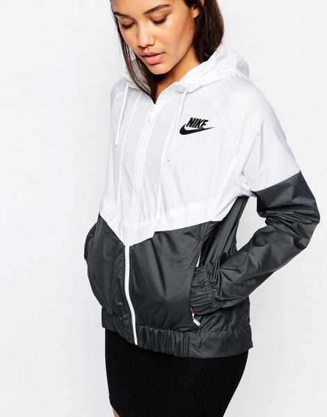 white and black color block windbreaker with skinny jeans