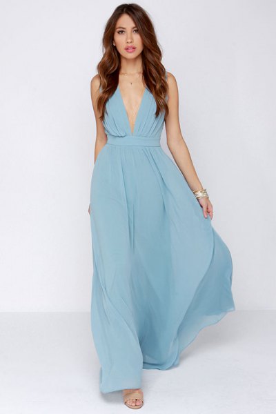Light blue maxi dress with a deep v-neck and silver necklace