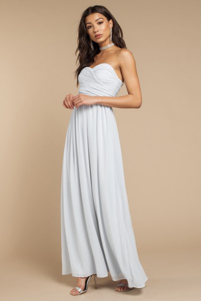 silver choker with light blue maxi dress with a heart-shaped neckline