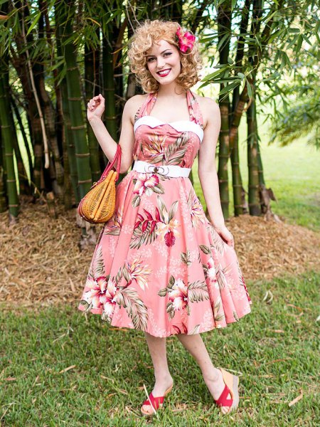pink halter fit with floral print and flared midi dress