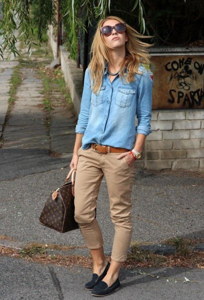 Light blue chambray shirt with buttons and green khaki pants