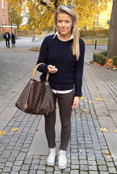 black knit sweater with white shirt and gray skinny pants