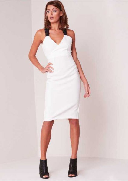 white bodycon dress with v-neck and black straps
