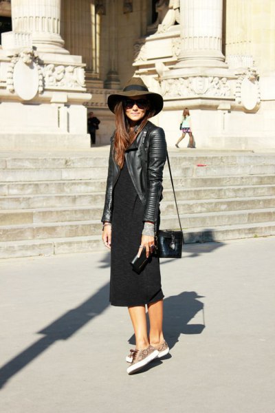 black leather jacket with floppy hat and black shift midi dress with sleeves