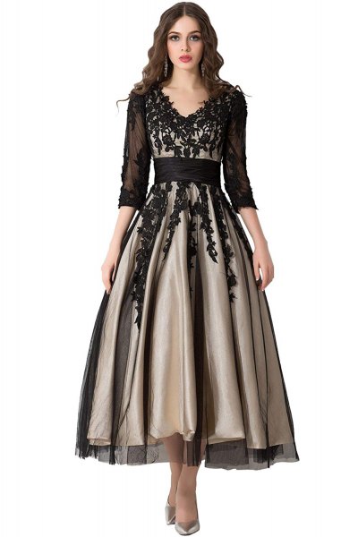 black, semi-transparent dress with three-quarter sleeves and floor-length dress with a lace V-neck