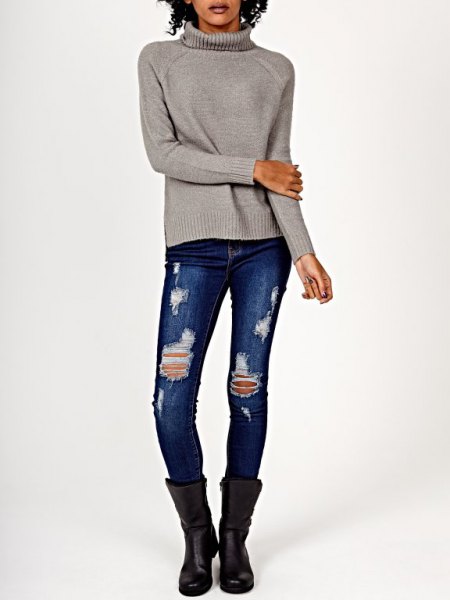 gray knitted sweater with torn skinny jeans