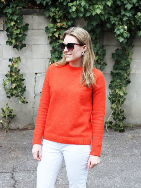orange, chunky cotton sweater with white skinny jeans