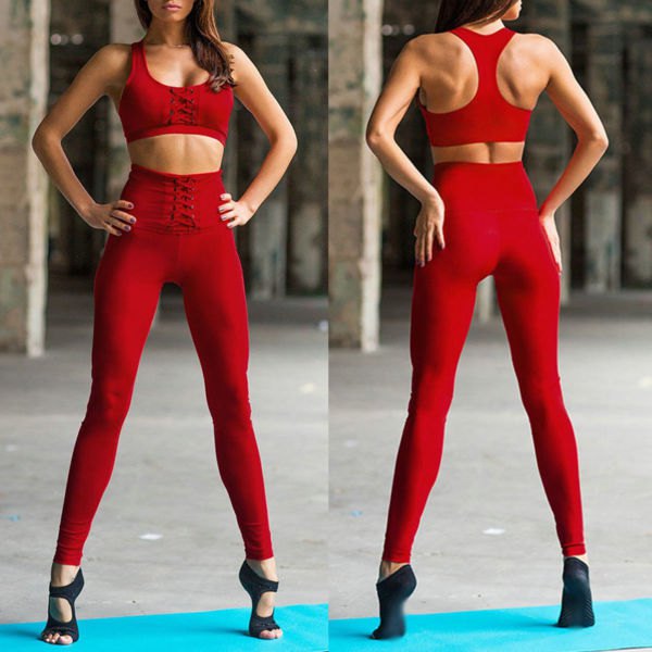 red sports bra top with matching high-waisted lace-up workout leggings