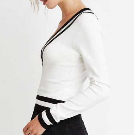 white sweater with black miniskirt