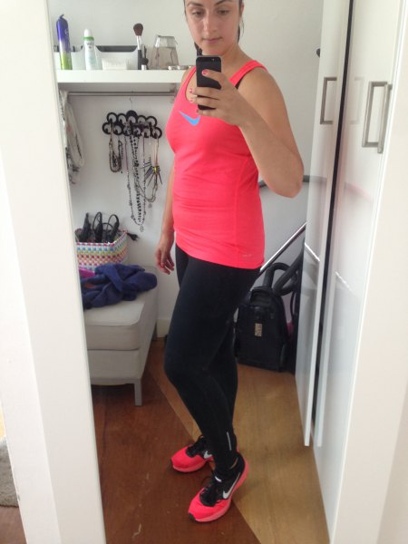 pink tank top with black running gaiters and sneakers