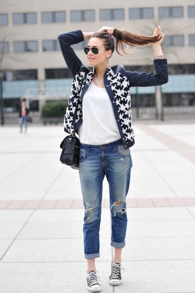 black and white printed leather jacket with really torn jeans