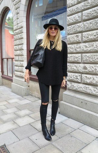 black knitted sweater with matching jeans and leather ankle boots