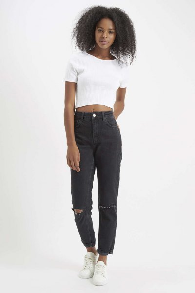 white short t-shirt with black torn mom jeans