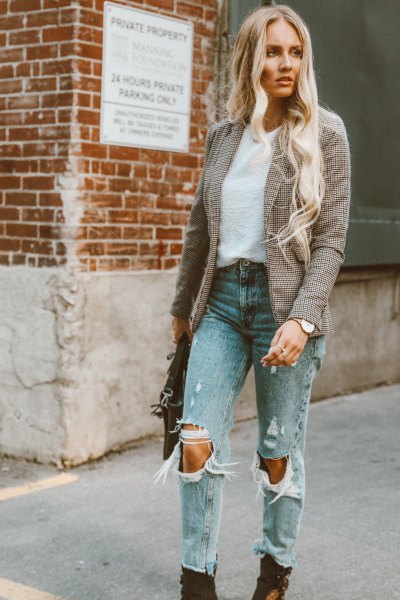 Tweed blazer with torn mom jeans and black boots
