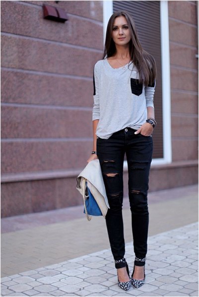 white and black front pocket t-shirt with torn jeans and heels with ankle straps