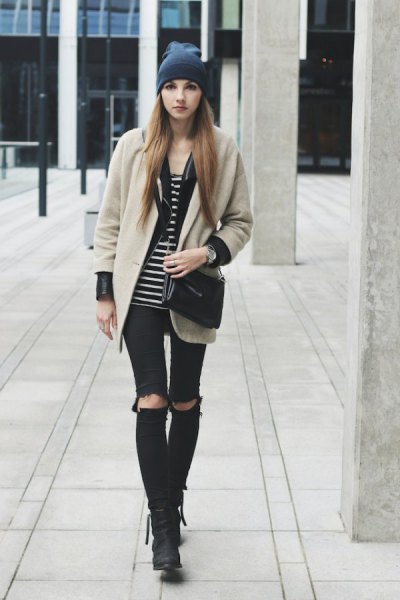 Blushing pink wool coat with black and white striped tank top and torn knee jeans