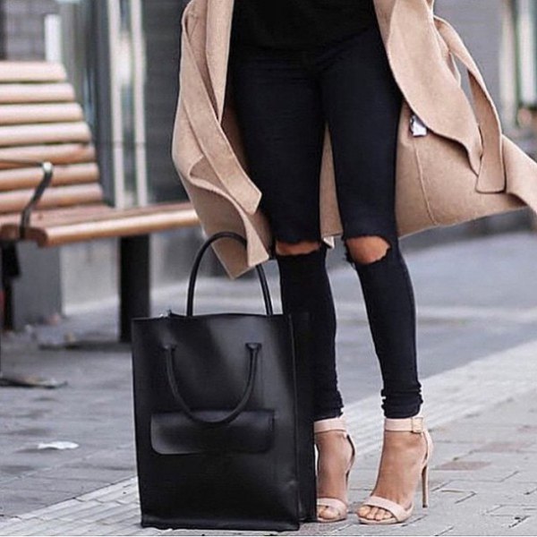 Blushing pink wool coat with black, torn jeans