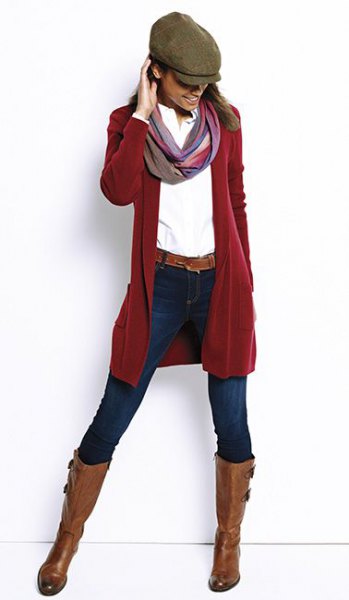 red longline cardigan with white shirt and flat hat