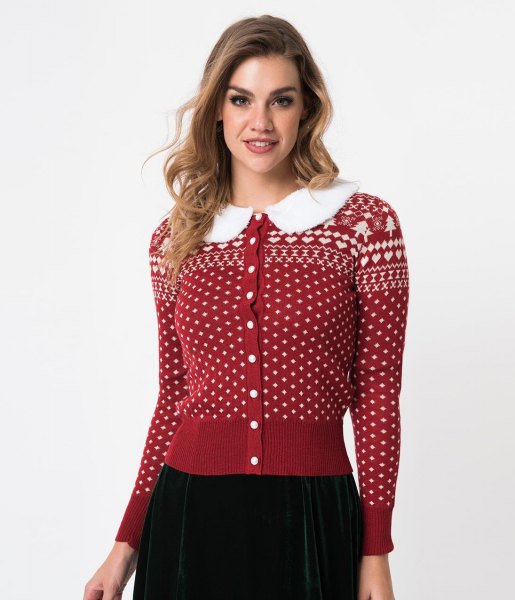 red and white Christmas cardigan with button and black skirt