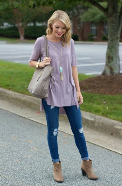 gray tunic t-shirt with blue skinny jeans with cuffs and brown suede boots