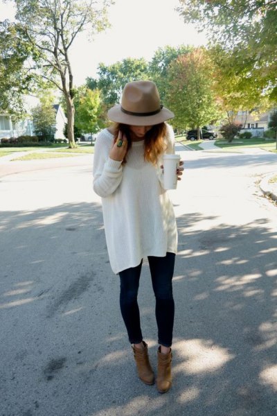 Rouge hat with white oversized sweater and camel suede ankle boots