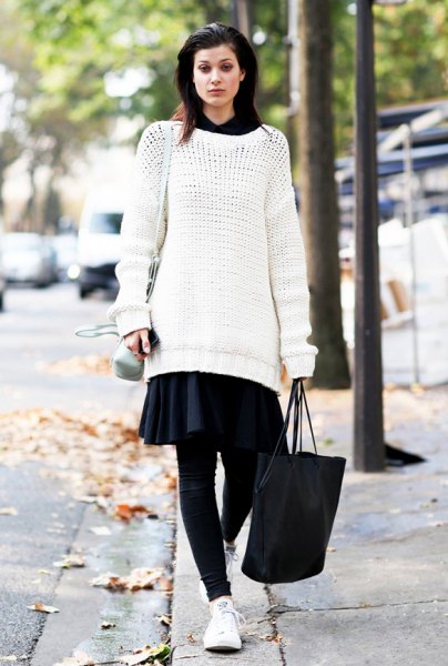 white tunic sweater with black miniskirt