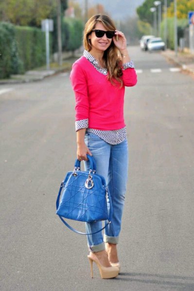 pink knit sweater with black and white polka dot shirt and jeans with cuffs