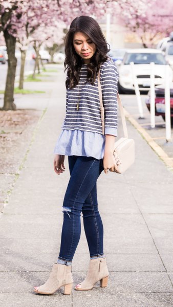 gray and white striped top over light blue peplum blouse