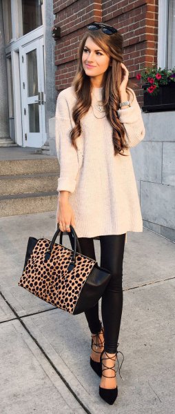 Light pink tunic knit sweater with black, narrow leather pants