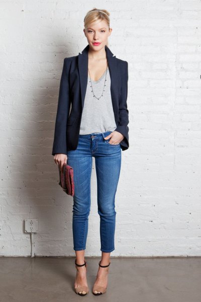 dark blazer with gray t-shirt with a deep scoop neck and short jeans