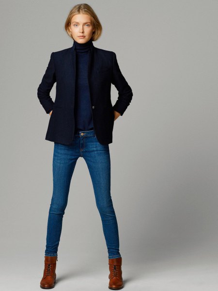 Dark blue sweater with stand-up collar and matching jacket and skinny jeans