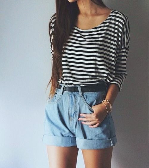black and white striped t-shirt with a scoop neck and light blue, unwashed high-rise shorts