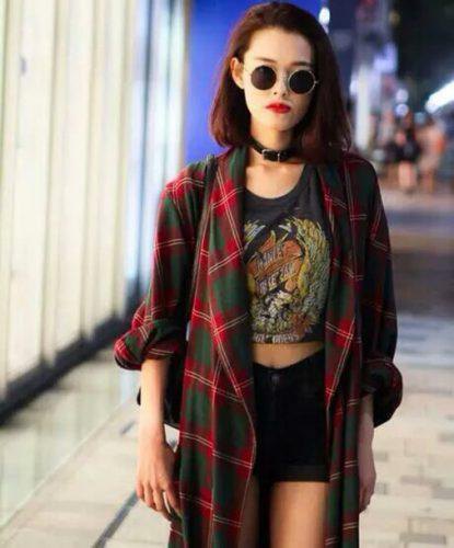 red oversized checkered flannel shirt with shortened black t-shirt and denim shorts